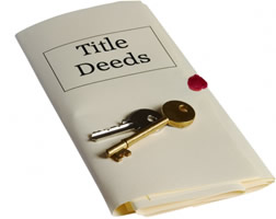 a folder labeled Title Deeds with keys sitting on top